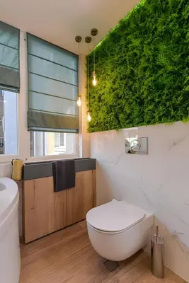 a bathroom with a white toilet and a green wall at Urban Eden - LUX & STYLE, 2-Bedroom, 2-Bathroom in Sofia