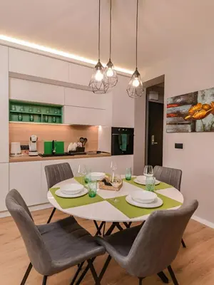 a kitchen and dining room with a table and chairs at Urban Eden - LUX & STYLE, 2-Bedroom, 2-Bathroom in Sofia
