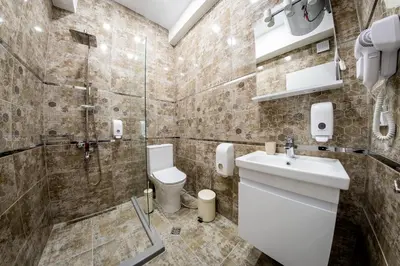 a bathroom with a shower and a toilet and a sink at Sofia Artist Life Apartment in Sofia