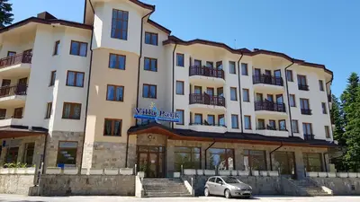 a building with a car parked in front of it at Villa Park Studio&Double room in Borovets