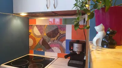 a kitchen with a counter top with a coffee pot on a stove at Cozy apartment in the historical center of Sofia in Sofia