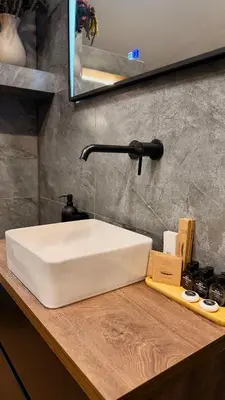a white sink sitting on top of a counter at Deluxe 707 in Borovets