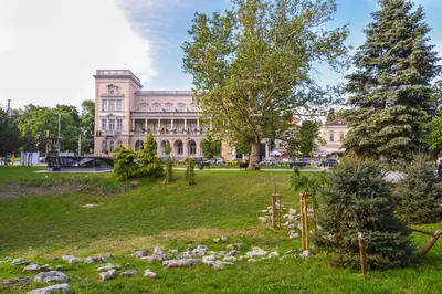 a park in front of a large building at MOCCA Studio next to Crystal Garden and Russian Church by Flat Mаnager in Sofia