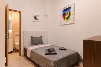 a small bedroom with a bed and a bathroom at CACAO Studio next to Crystal Garden and Russian Church by Flat Mаnager in Sofia