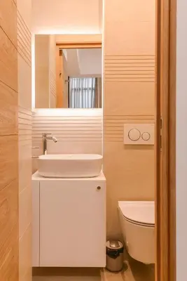 a bathroom with a sink and a toilet and a mirror at CACAO Studio next to Crystal Garden and Russian Church by Flat Mаnager in Sofia