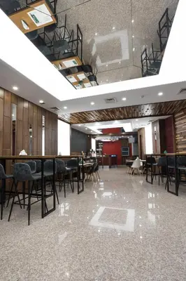 a large room with chairs and tables in it at B1 Boutique Hotel Sofia in Sofia