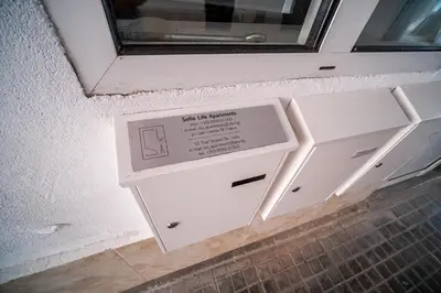 a door in a wall with a window in a room at Sofia Downtown Life Apartment in Sofia