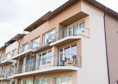 a building with balconies and plants on it at Apartment Petya in Velingrad