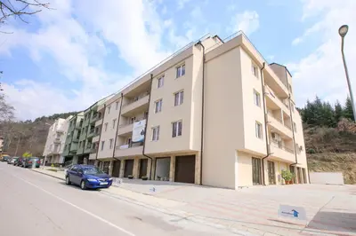 a car parked in front of a building at Sunpark Apartment in Sandanski