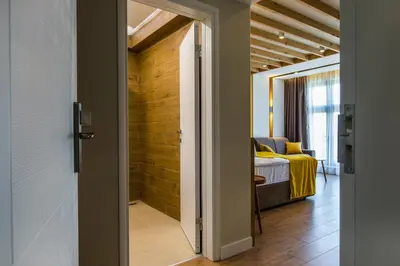 a door leading to a bedroom with a bed at HillHouse Plovdiv in Plovdiv
