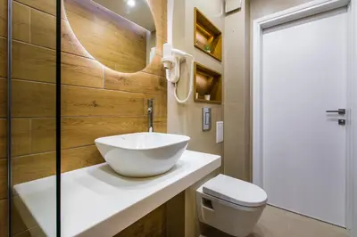 a bathroom with a sink and a toilet at HillHouse Plovdiv in Plovdiv