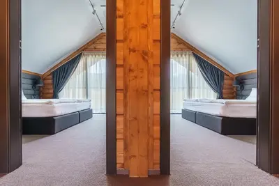 two mirrors in a room with two beds at Samovilla in Govedartsi