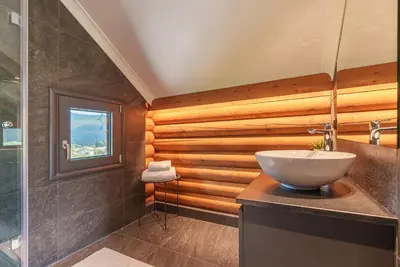 a bathroom with a sink and a glass shower at Samovilla in Govedartsi