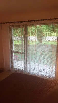 a window in a room with a curtain at Вила Керенски in Ribarica
