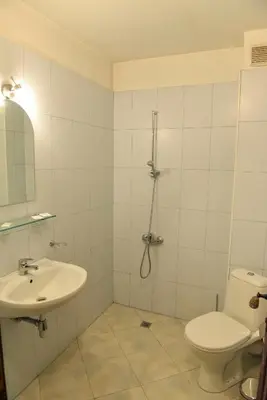 a bathroom with a toilet and a sink at Lovna sreshta in Bansko