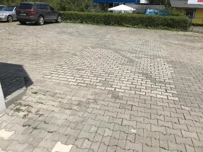 a brick parking lot with a car parked in it at МОТЕЛ СИТИ с БЕЗПЛАТЕН ПАРКИНГ in Plovdiv