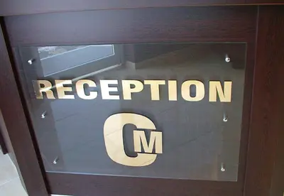 a window with the reflection of a sign in a drawer at МОТЕЛ СИТИ с БЕЗПЛАТЕН ПАРКИНГ in Plovdiv