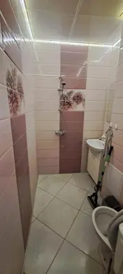 a bathroom with a shower and a toilet at lux in Plovdiv