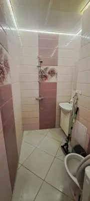 a bathroom with a shower and a toilet and a sink at lux in Plovdiv