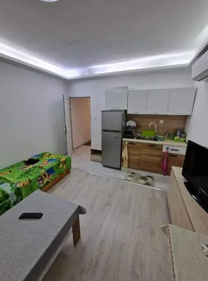 a room with a kitchen and a living room at lux in Plovdiv