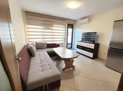 a living room with a couch and a coffee table at lux in Plovdiv