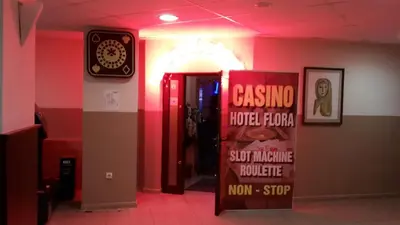 a restaurant with a sign that reads casino house iron and a sign that says at VIVA Flora apartment 607A in Borovets