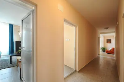 a hallway with an open door in a house at Best Rest Guest Rooms in Plovdiv