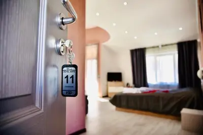 a room with a door with a room with a bed at NAYS in Madan