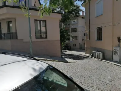 a car parked on a street next to a building at Casa Lavenda in Plovdiv