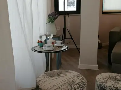 a small table with cups and glasses on it at Casa Lavenda in Plovdiv