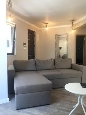 a living room with a couch and a table at Casa Lavenda in Plovdiv