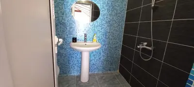 a bathroom with a sink and a shower at Къща за гости DANI DREAM in Sapareva Banya