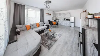 a living room with a couch and a table at NEXT TO GONDOLA Stylish and Charming apartment in Bansko