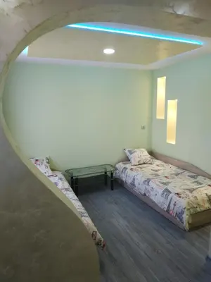 a room with a bed and a table in it at ВИЙГ in Sapareva Banya