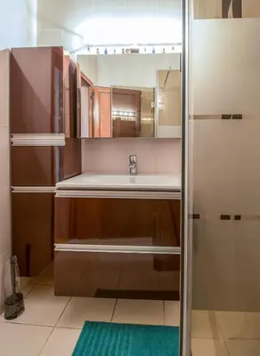 a bathroom with a sink and a mirror at The Rocky House - Central & Private 2BDR by Flat Mаnager in Plovdiv