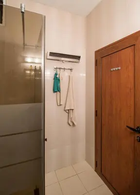 a bathroom with a shower and a glass door at The Rocky House - Central & Private 2BDR by Flat Mаnager in Plovdiv