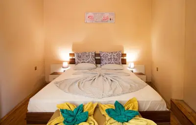 a bedroom with a large bed with two pillows at The Rocky House - Central & Private 2BDR by Flat Mаnager in Plovdiv