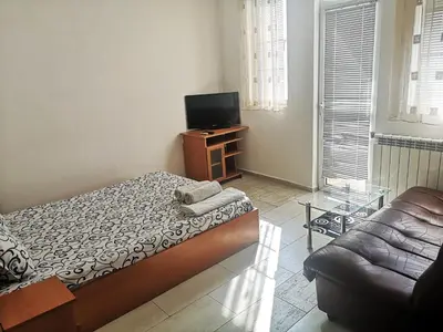 a living room with a bed and a couch at Merilyn Petrich in Petrich