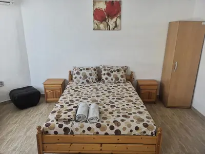a bedroom with a bed with shoes on it at Merilyn Petrich in Petrich