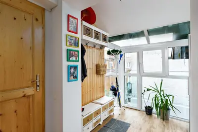 a room with a door and a window with a bench at 3BDR The Hadjis - City Center Flat in Sofia