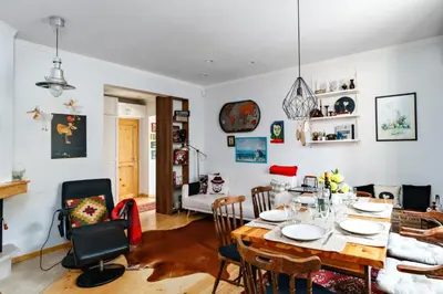 a dining room and living room with a table and chairs at 3BDR The Hadjis - City Center Flat in Sofia