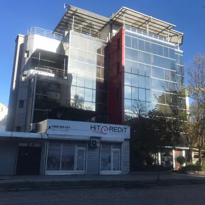 a building with a huff coefficient sign in front of it at Lilia 4 Self-Check in apartment in Sofia