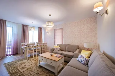 a living room with a couch and a table at Predela LUX Aparthotel in Bansko