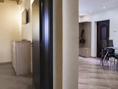 a room with a table and a dining room at Relax in Dobrinishte