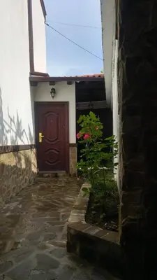 a door of a building with a plant in front of it at Relax in Dobrinishte