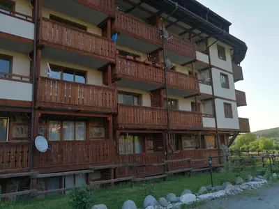 a building with balconies on the side of it at G-Apartment, New Inn, 2-rooms in Bansko