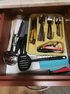 a tray with utensils sitting on top of a table at G-Apartment, New Inn, 2-rooms in Bansko