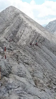 a group of people on a rocky mountain at Тодор Прегьов in Bansko