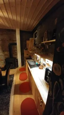 a kitchen with a stove and a counter top at EskiZ - Our stone home in Chepelare