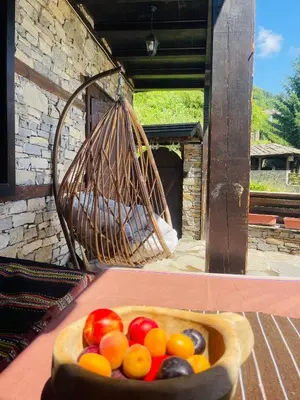 a bowl of fruit sitting on top of a table at Къща за гости Родопски изгрев in Leshten